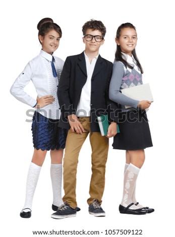 Schoolchildren wearing school uniform full length picture against white background