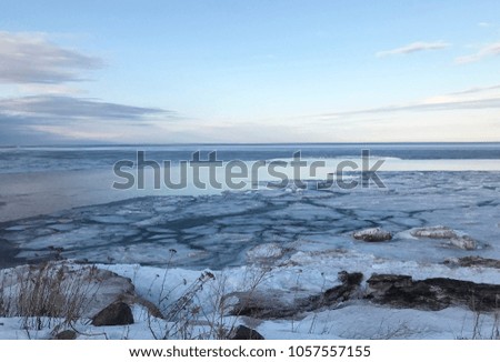 Lake Superior in Marquette, MI during spring thaw. Sunset. Upper Peninsula Michigan. Horizon. 