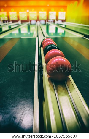 Retro style picture of the Ninepin bowling balls. Picture is deliberately a bit grainy and has light leaks.