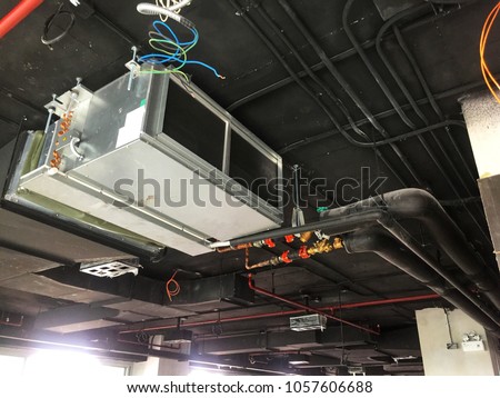 Installation of Air handing unit or Fan coil unit in loft office Royalty-Free Stock Photo #1057606688