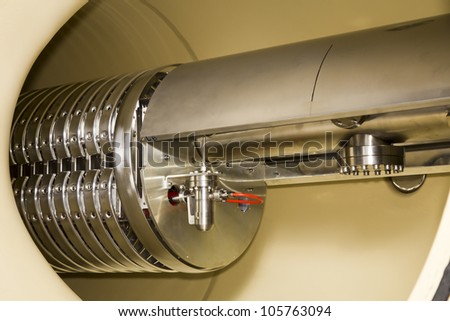 Interior view of important electronic and mechanical parts of opened ION Accelerator, during maintenance every 7-8 years ! Royalty-Free Stock Photo #105763094