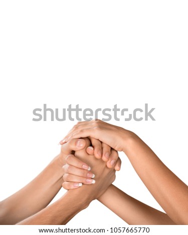 Three human join hands together