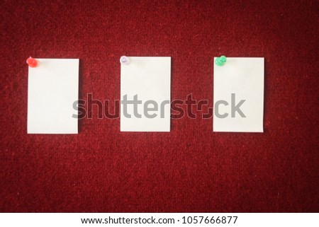 collection of note papers pinned on a red board ready for filling in quotes.