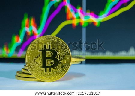 Golden Bitcoin with stock exchange market graph background. Digital money trading concept.