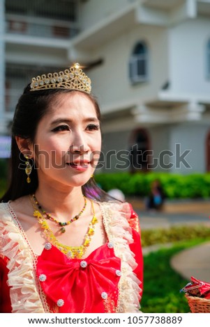 Beautiful young princess and queen in red long dress.Asia pretty woman in portrait fashion.