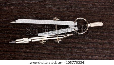 Drafting instrument on wooden background
