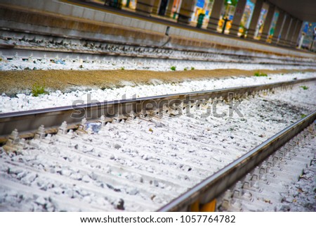 Railroad tracks   with white gravel in Italy. Selective focus. Industrial concept background. Railroad travel, railway tourism.
