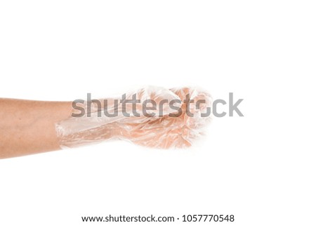 Side view of beautiful human hand palm dressed in new nice and soft polyethylene plastic gloves isolated on abstract white background. Wearing and special clothes concept. Detailed closeup stidio shot