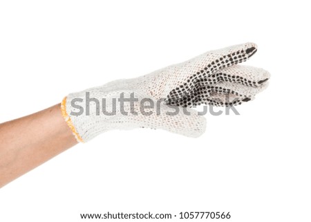 Side view of beautiful human hand palm dressed in new nice and soft natural cotton fabric glove isolated on abstract white background. Wearing and special clothes concept. Detailed closeup studio shot