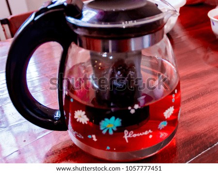 Pictured in the photo glass teapot on the table.