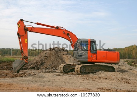 Photo of a working excavator in the countryside