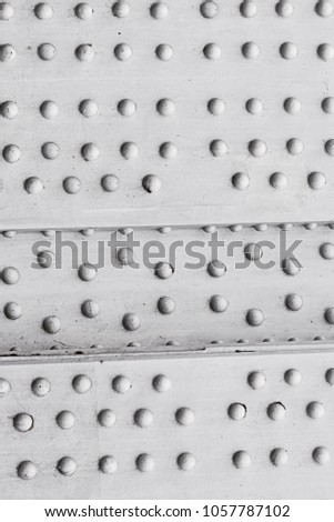 industrial horizontal pattern metal surface with round rusty rivets grunge design base weathered gray