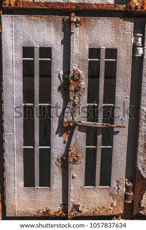 old tick steel rusted doors which are closed