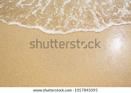 Sea Beach and Soft wave of blue ocean. Summer day and sandy beach background