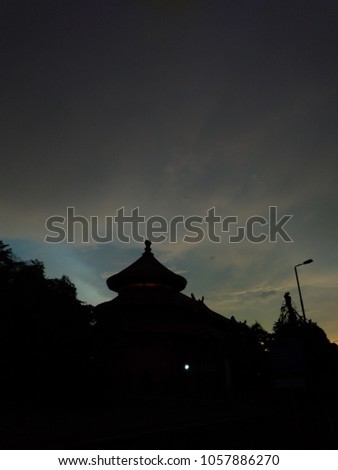 Silhouette of Kelenteng and trees