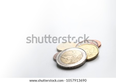 Several euro coins on light blurred background. Two euro. Closeup photo