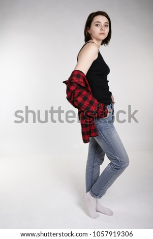 beauty female in red shirt and jeans casual clothes on white background