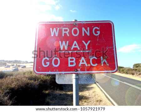 Wrong way go back sign concept