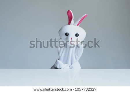 playing puppet on the white background. reaction. Emotional. Rabbit