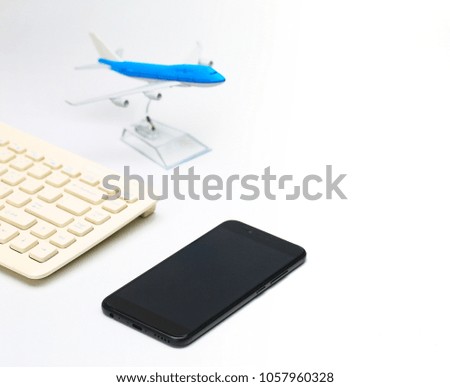 plane model,smartphone,keyboard on white background