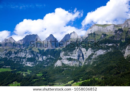 Dolomites Apls, Switzerland panorama. Dolomites Alps landscape, green valley with high mountains and blue sky.