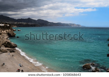 View of sea with beach and mountains