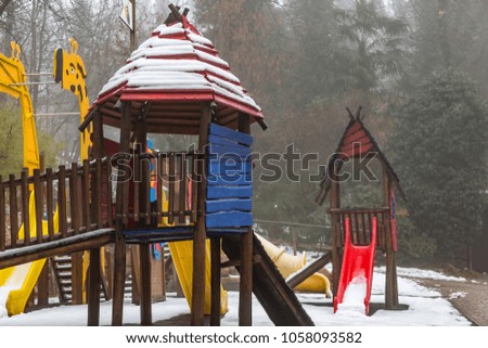 A playground, playpark, or play area,  playground structure for small children; slides, climbers (stairs in this case)