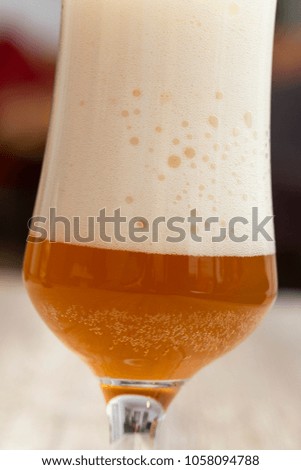 Tilted glass with beer