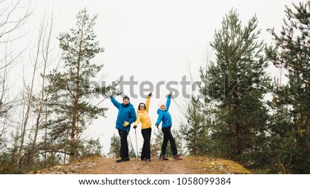 People are photographed in the forest