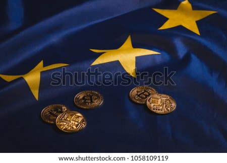 Golden bitcoins laying on  EU flag