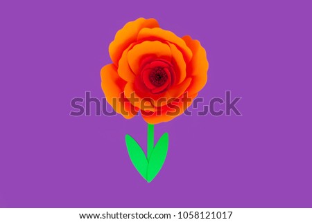 Handmade paper cut flower on violet paper background, element for invitation or design. 