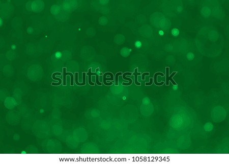 Abstract green bokeh background. Blurred bright light. Circular points. Colorful. Defocused background.
