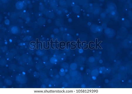 Abstract blue bokeh background. Blurred bright light. Circular points. Colorful. Defocused background.

