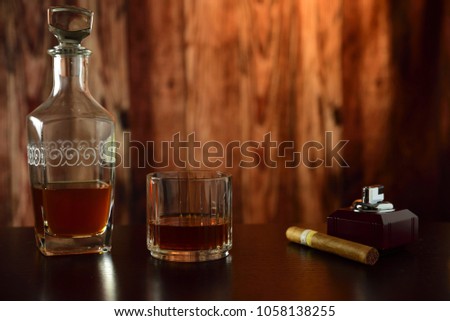 in a wooden environment a cigar and liqueur