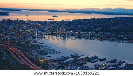 High Above City of Seattle Lake Union Puget Sound San Juan Islands Olympic Mountains Orange Sunset Sky Glowing Clouds Ships Ferry Waterfront