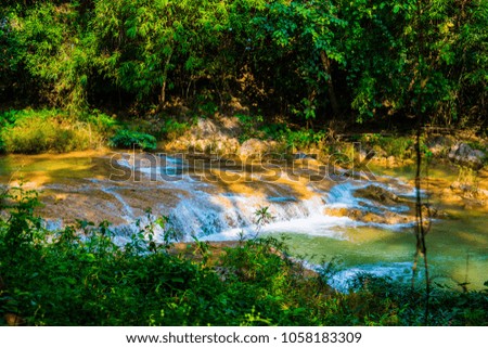 Water flowing at Than Sawan waterfall, Thailand.