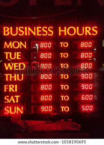 Red neon business hours sign