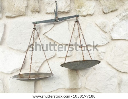 Old scale on white stone background