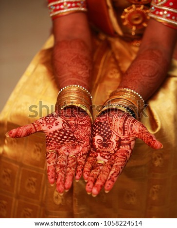 Hands painted with henna close up