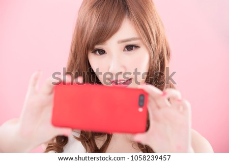 beauty woman selfie on the pink background