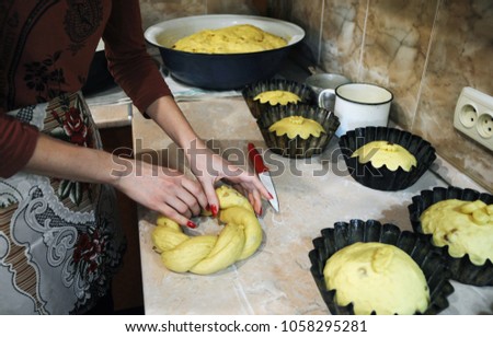Woman is making cakes with dough