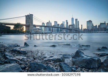 From a famous view point at dumbo Brooklyn to take the picture of Brooklyn bridge and Manhattan skyscrapers at blue hour, there`s still a little sunshine however the sky started turning blue. 
