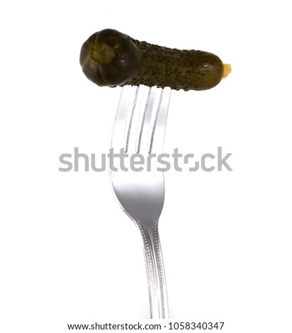 Marinated cucumber, pinned on a fork