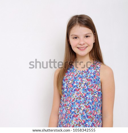 Happy emotional teen girl studio portrait 