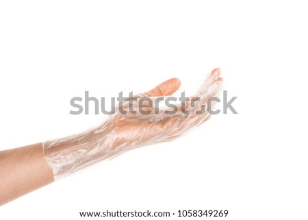 Side view of beautiful human hand palm dressed in new nice and soft polyethylene plastic gloves isolated on abstract white background. Wearing and special clothes concept. Detailed closeup stidio shot