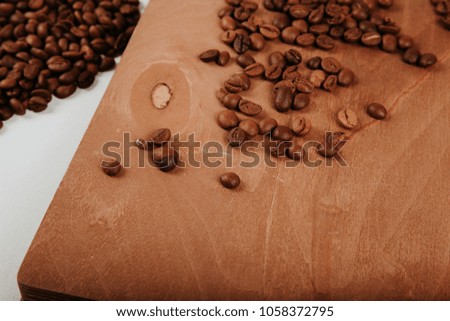 fragrant black arabic coffee beans on a wooden stand