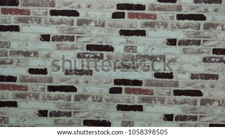 The building is painted brick wall