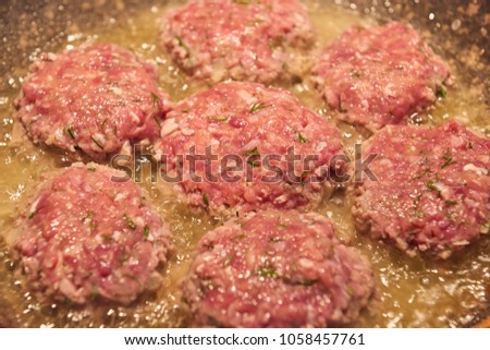 meat cutlets are fried on a frying pan, food