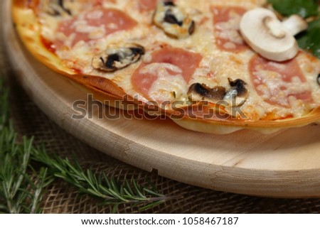 delicious pizza on a wooden tray