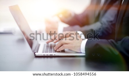 closeup.businessman working on laptop